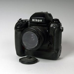 35mm Nikon F5 camera with lens